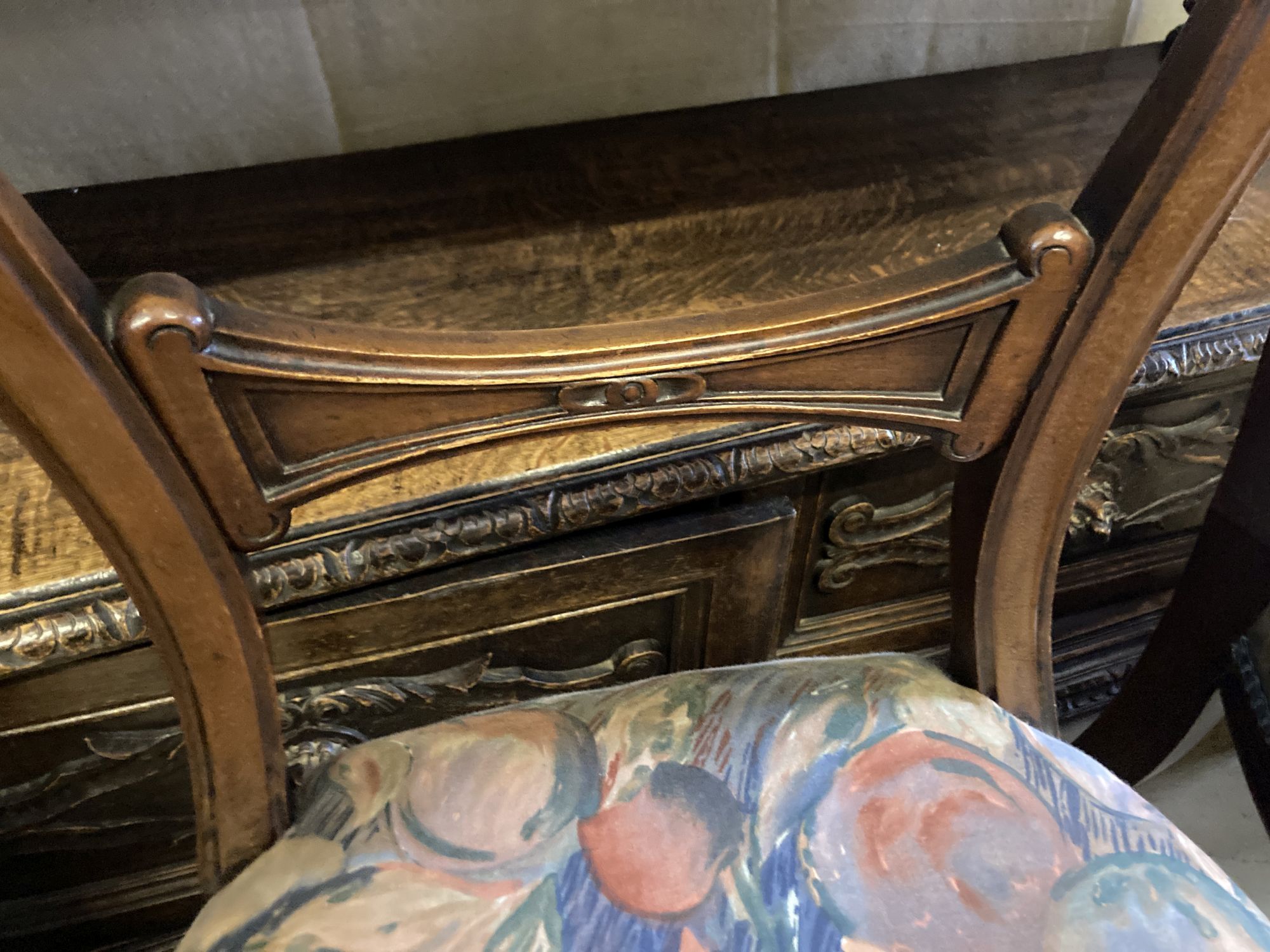 A Victorian rosewood oval tilt top loo table, length 150cm, depth 110cm, height 74cm and a matched set of six Victorian mahogany balloo